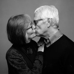 Midsection of couple kissing