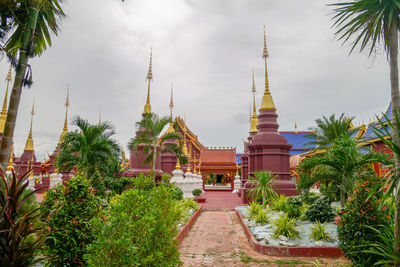 View of temple building against cloudy sky