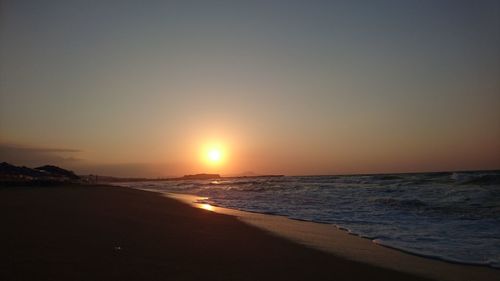 View of beach at sunset