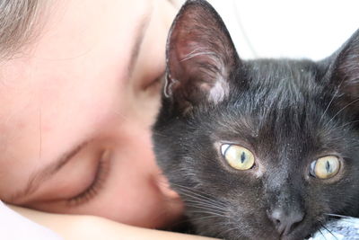 Close-up portrait of black cat
