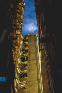 Illuminated city against sky at night