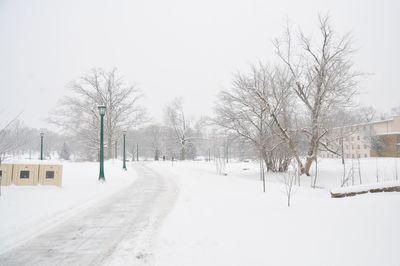 Road passing through snow covered landscape