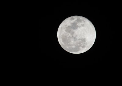 Low angle view of full moon in sky