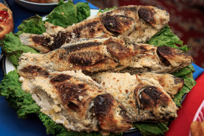 Close-up of fish on barbecue grill