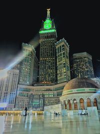 Low angle view of illuminated buildings at night