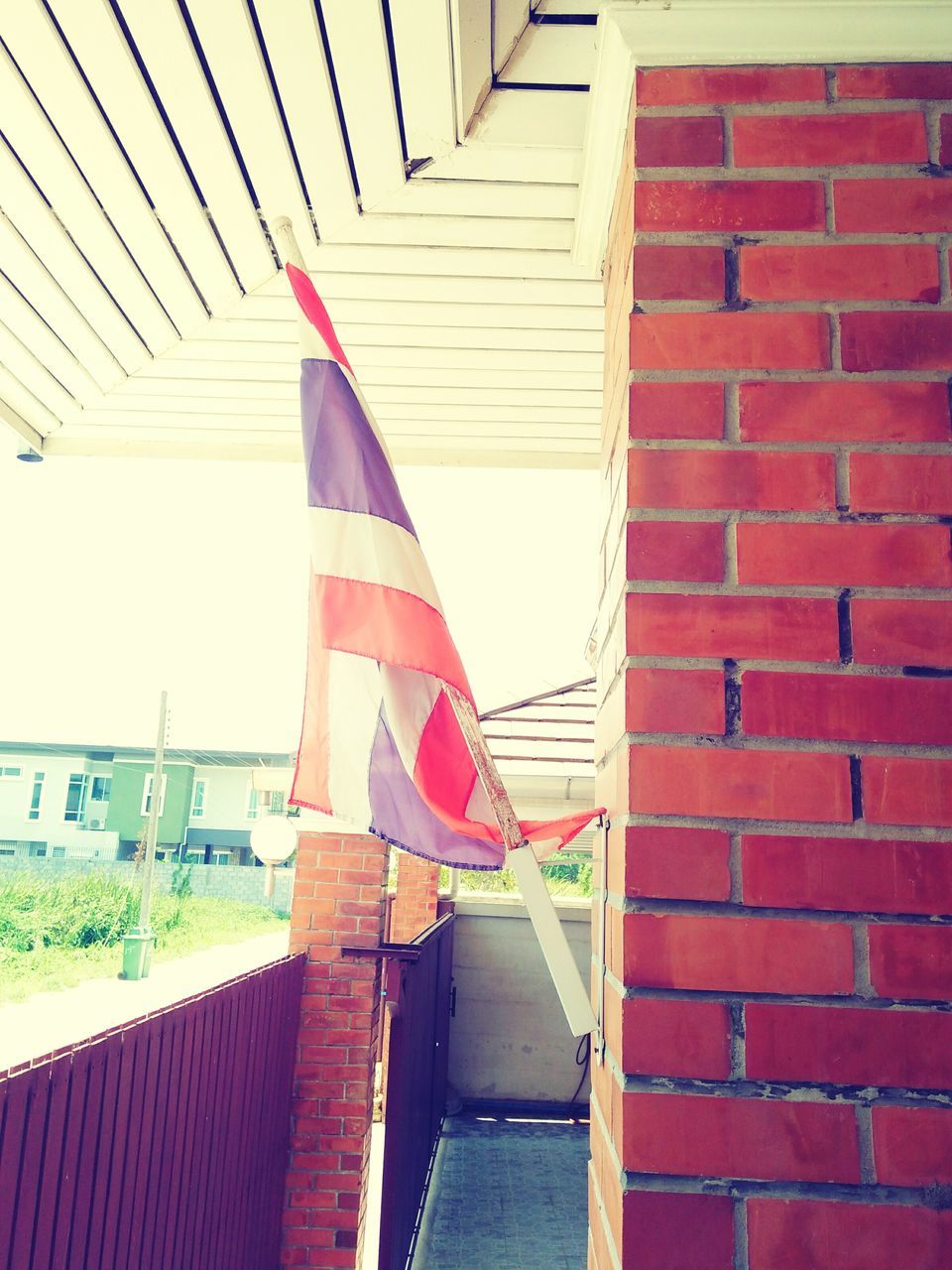 architecture, built structure, building exterior, red, steps, staircase, railing, steps and staircases, low angle view, day, house, american flag, building, no people, striped, outdoors, sunlight, stairs, flag, patriotism