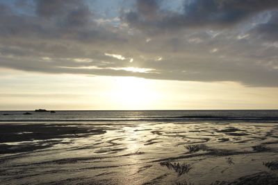 Scenic view of sea against sky at sunset