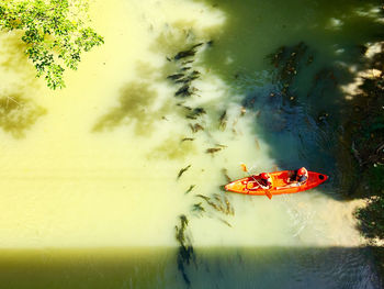 High angle view of people in boat on lake