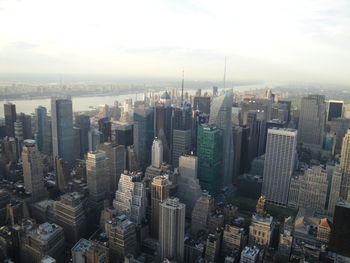 High angle view of modern buildings in city against sky