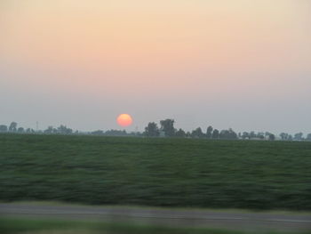 Scenic view of landscape at sunset