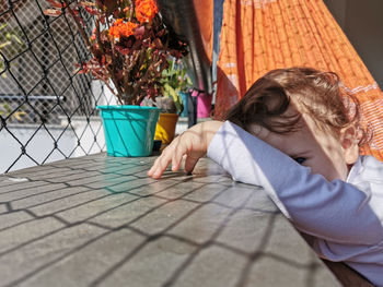 Rear view of girl playing outdoors