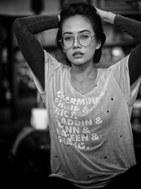 Portrait of young woman posing indoors