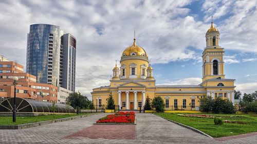 View of buildings against cloudy sky