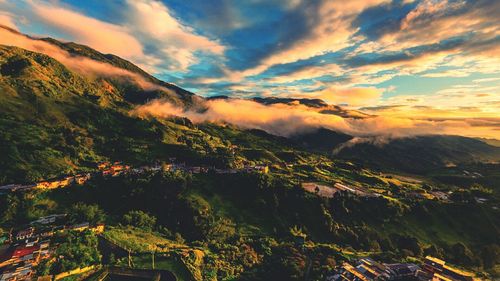 Scenic view of landscape against sky at sunset