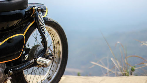 Close-up of bicycle parked on field