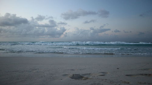 Scenic view of beach against sky