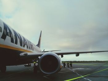 Cropped image of airplane on road