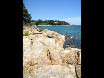 Close-up of sea against clear blue sky