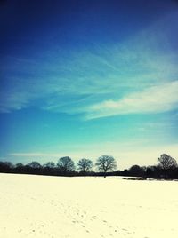 Scenic view of landscape against blue sky