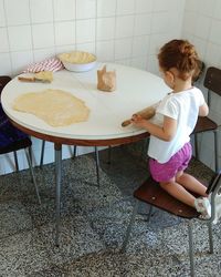 Boy sitting on chair