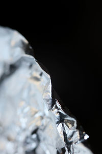 Close-up of rock against black background