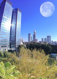 Low angle view of buildings against blue sky