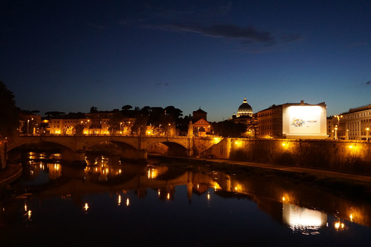 illuminated, architecture, built structure, night, water, building exterior, reflection, river, connection, city, waterfront, bridge - man made structure, sky, bridge, canal, street light, lighting equipment, outdoors, no people, arch bridge