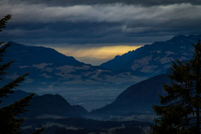 Scenic view of mountains against sky at sunset