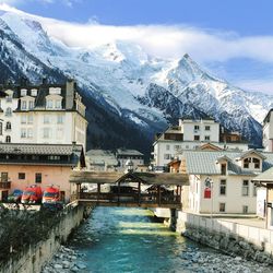 Wooden footbridge in town in scenic mountains