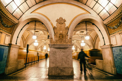 People walking at railroad station