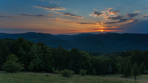 Scenic view of mountains against sky during sunset