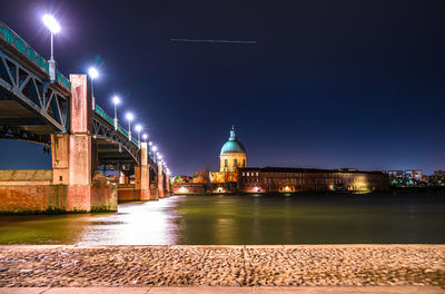 Illuminated buildings at waterfront