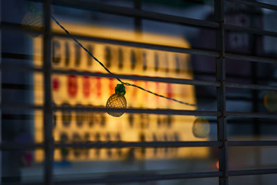 Close-up of lighting equipment on window