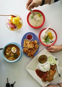 High angle view of person preparing food on table