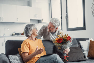 Side view of family sitting at home