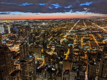 High angle view of illuminated buildings in city