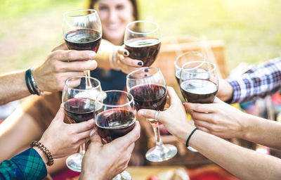 Midsection of people drinking glasses