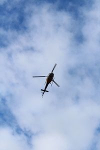 Low angle view of airplane in sky