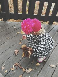 Woman walking on dry leaves