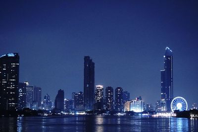 Illuminated buildings in city at night