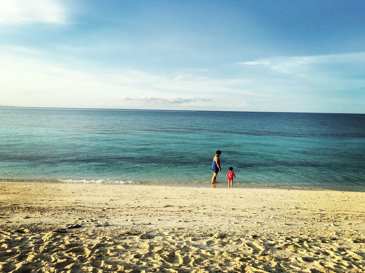 SILHOUETTE OF PEOPLE ON BEACH