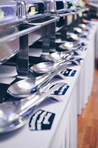 Containers with spoons arranged on table in ceremony