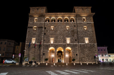 Low angle view of illuminated building at night