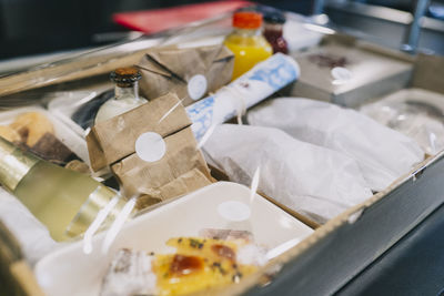 Close-up of food packages in cardboard box at restaurant