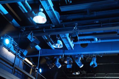 Low angle view of illuminated ceiling at night