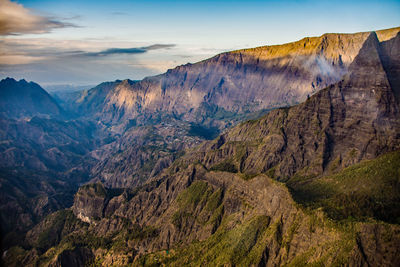 Scenic view of mountains against cloudy sky