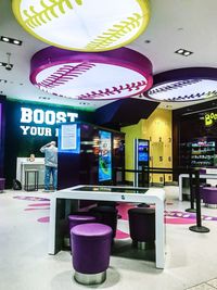 Man standing in illuminated store