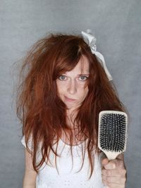 Portrait of young woman with microphone