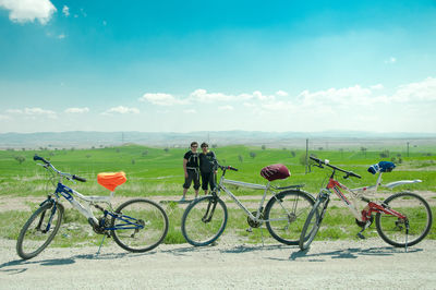 Bicycles on road against sky