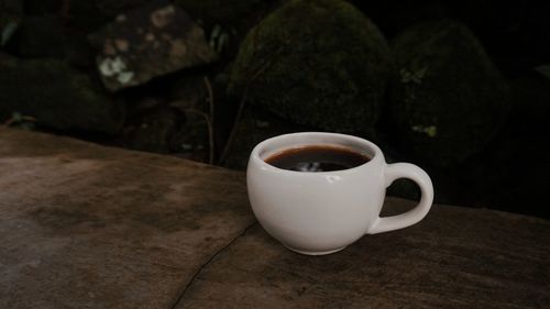 Close-up of coffee cup on table